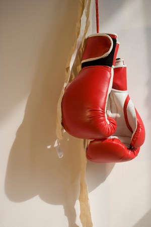 Red Boxing Gloves Hanging on Wall